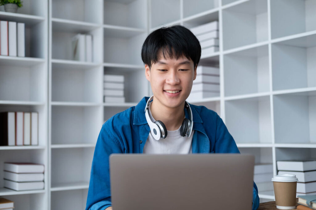 Successful student working on their work in an office space, Command Education